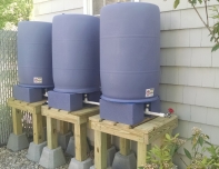 Elevated rain barrels